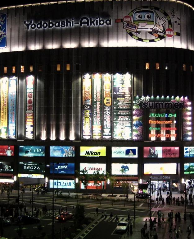 A facade covered in illuminated signs