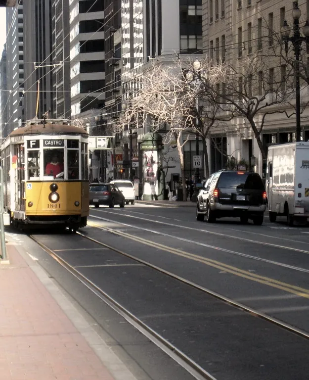 A tram running down a broad avenue